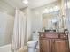 Bathroom with shower, toilet, vanity and dark wood cabinet at 2701 Kashton Dr., Myrtle Beach, SC 29577