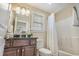 Bathroom with shower, toilet, vanity with granite counter, and white towels at 2701 Kashton Dr., Myrtle Beach, SC 29577