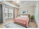 Cozy bedroom with a tray ceiling, comfortable bed, large window with curtains, and stylish decor at 2701 Kashton Dr., Myrtle Beach, SC 29577