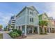 Bright and inviting beach home with a lovely exterior and coastal charm, raised on stilts near the beach at 2701 Kashton Dr., Myrtle Beach, SC 29577