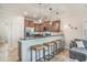 Modern kitchen featuring a breakfast bar with stools, stainless steel appliances, and sleek countertops at 2701 Kashton Dr., Myrtle Beach, SC 29577