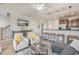 Open concept living room featuring modern decor, a comfortable seating area, and a view of the dining area at 2701 Kashton Dr., Myrtle Beach, SC 29577