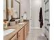 Bright bathroom featuring double sinks and a shower with a curtain at 2876 Howard Ave. # C, Myrtle Beach, SC 29577