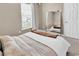 Neutral bedroom featuring a large mirror reflecting the bed and window at 2876 Howard Ave. # C, Myrtle Beach, SC 29577