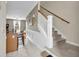 Open-concept entryway with stairs leading up and clear sightlines into the kitchen and living area at 2876 Howard Ave. # C, Myrtle Beach, SC 29577