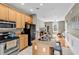 Open kitchen with granite counters, stainless appliances, and island flowing to living area at 2876 Howard Ave. # C, Myrtle Beach, SC 29577