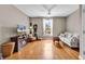 Bright living room with hardwood floors, ceiling fan, and natural light at 2876 Howard Ave. # C, Myrtle Beach, SC 29577