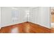Bedroom with hardwood floors, closet, and a window providing natural light at 310 74Th Ave. N # 7, Myrtle Beach, SC 29572