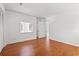 Bright bedroom features hardwood floors and closet, with open doorway leading to bathroom at 310 74Th Ave. N # 7, Myrtle Beach, SC 29572
