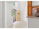 Bright foyer with tiled floors, decorative front door, and an open view into adjacent rooms at 310 74Th Ave. N # 7, Myrtle Beach, SC 29572