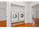 Convenient laundry room featuring a side by side washer and dryer and white cabinets at 310 74Th Ave. N # 7, Myrtle Beach, SC 29572