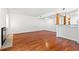 Minimalist living room with hardwood floors, a tiled fireplace, and an open layout to the kitchen area at 310 74Th Ave. N # 7, Myrtle Beach, SC 29572