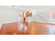 Bright and airy living room featuring hardwood floors and an open floor plan connecting to the kitchen and staircase at 310 74Th Ave. N # 7, Myrtle Beach, SC 29572