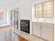 Cozy living room with a fireplace, built-in cabinets, and sliding glass doors leading to the patio at 310 74Th Ave. N # 7, Myrtle Beach, SC 29572