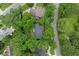 Aerial view of the home with a wooded lot, established landscaping, and mature trees at 311 Ashwood Ln., Myrtle Beach, SC 29588