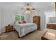 Neutral bedroom with ceiling fan, carpeted floors and access to en suite bathroom at 311 Ashwood Ln., Myrtle Beach, SC 29588