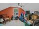 An attic bonus room features a ceiling fan, a window and is filled with various items at 311 Ashwood Ln., Myrtle Beach, SC 29588