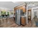 Eat-in kitchen featuring stainless steel refrigerator and wood cabinetry plus wood flooring at 311 Ashwood Ln., Myrtle Beach, SC 29588