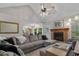 Bright and airy living room with a fireplace, vaulted ceiling, and comfortable seating at 311 Ashwood Ln., Myrtle Beach, SC 29588