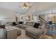 Spacious living room featuring a large sectional sofa, vaulted ceiling, and stylish decor at 311 Ashwood Ln., Myrtle Beach, SC 29588