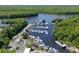 High aerial of marina filled with an array of boats, set against a backdrop of verdant trees and waterway at 3154 Shorecrest Bay Dr., Murrells Inlet, SC 29576