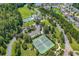 Aerial view of the community amenities featuring a pool, clubhouse, and tennis courts at 3154 Shorecrest Bay Dr., Murrells Inlet, SC 29576