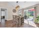 Bright dining area with a modern table, wine rack, and sliding glass door leading to the backyard at 3154 Shorecrest Bay Dr., Murrells Inlet, SC 29576