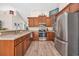 Well-lit kitchen featuring stainless steel appliances, light countertops, and wooden cabinets at 3154 Shorecrest Bay Dr., Murrells Inlet, SC 29576