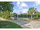 Community tennis court, featuring a secure fence, manicured hedges and lush landscaping at 3154 Shorecrest Bay Dr., Murrells Inlet, SC 29576