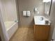 Functional bathroom with a tub, vanity, mirror, and fresh towels, designed for comfort and convenience at 3601 N Ocean Blvd. # 1139, North Myrtle Beach, SC 29582