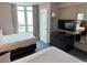 Bright bedroom featuring two cozy beds, a TV, and a window with scenic views of the outside area at 3601 N Ocean Blvd. # 1139, North Myrtle Beach, SC 29582