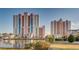Bright view of the colourful exteriors of two modern buildings sitting beside the water under a clear blue sky at 3601 N Ocean Blvd. # 1139, North Myrtle Beach, SC 29582