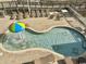 Aerial view of a swimming pool and lounge chairs at 3601 N Ocean Blvd. # 1139, North Myrtle Beach, SC 29582