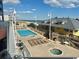 View of a large swimming pool with lounge chairs by beach at 3601 N Ocean Blvd. # 1139, North Myrtle Beach, SC 29582