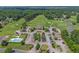 Aerial view of community clubhouse, pool, parking and a portion of a golf course at 3975 River Hills Dr., Little River, SC 29566