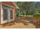Cozy back deck with outdoor seating, overlooks a meticulously maintained yard, perfect for relaxation at 3975 River Hills Dr., Little River, SC 29566