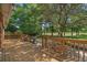 Expansive back deck with a grill, offering outdoor entertaining space with views of the well-maintained lawn at 3975 River Hills Dr., Little River, SC 29566