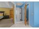 This bathroom has a walk in shower, blue walls and a door to the bedroom at 3975 River Hills Dr., Little River, SC 29566