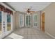 Breakfast nook with tile floor, ceiling fan, and windows with shuttered blinds at 3975 River Hills Dr., Little River, SC 29566