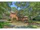 Charming home with a brick facade, featuring a back deck and well-maintained landscaping at 3975 River Hills Dr., Little River, SC 29566