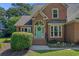 Charming brick home featuring a light blue front door, black shutters, and a professionally landscaped front yard at 3975 River Hills Dr., Little River, SC 29566