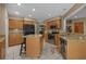 Kitchen featuring granite countertops, wooden cabinets, stainless steel appliances, and tile flooring at 3975 River Hills Dr., Little River, SC 29566