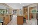 Open concept kitchen featuring granite countertops, stainless steel appliances, and a central island with barstools at 3975 River Hills Dr., Little River, SC 29566