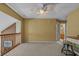The open loft features neutral paint, carpet, and a half wall overlooking downstairs at 3975 River Hills Dr., Little River, SC 29566