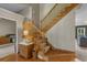 This home features a wood staircase with a marble topped table at the base of the stairs at 3975 River Hills Dr., Little River, SC 29566