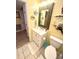 Bathroom with white vanity, decorative mirror, and coastal decor at 404 29Th Ave. N, North Myrtle Beach, SC 29582
