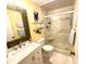 Bathroom featuring a vanity, toilet, and glass-enclosed shower with built-in seating at 404 29Th Ave. N, North Myrtle Beach, SC 29582