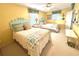 Bright bedroom with two twin beds, yellow walls, and tropical decor accents at 404 29Th Ave. N, North Myrtle Beach, SC 29582