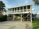 Coastal living at its finest with an American flag on the deck of this elevated home at 404 29Th Ave. N, North Myrtle Beach, SC 29582