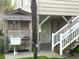 Charming outdoor area of this beach house, steps leading to an outdoor shower at 404 29Th Ave. N, North Myrtle Beach, SC 29582